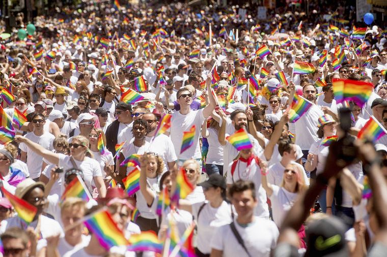 Apple employees carry rainbow flags as they march in the San Francisco Gay Pride Festival in California June 29, 2014.