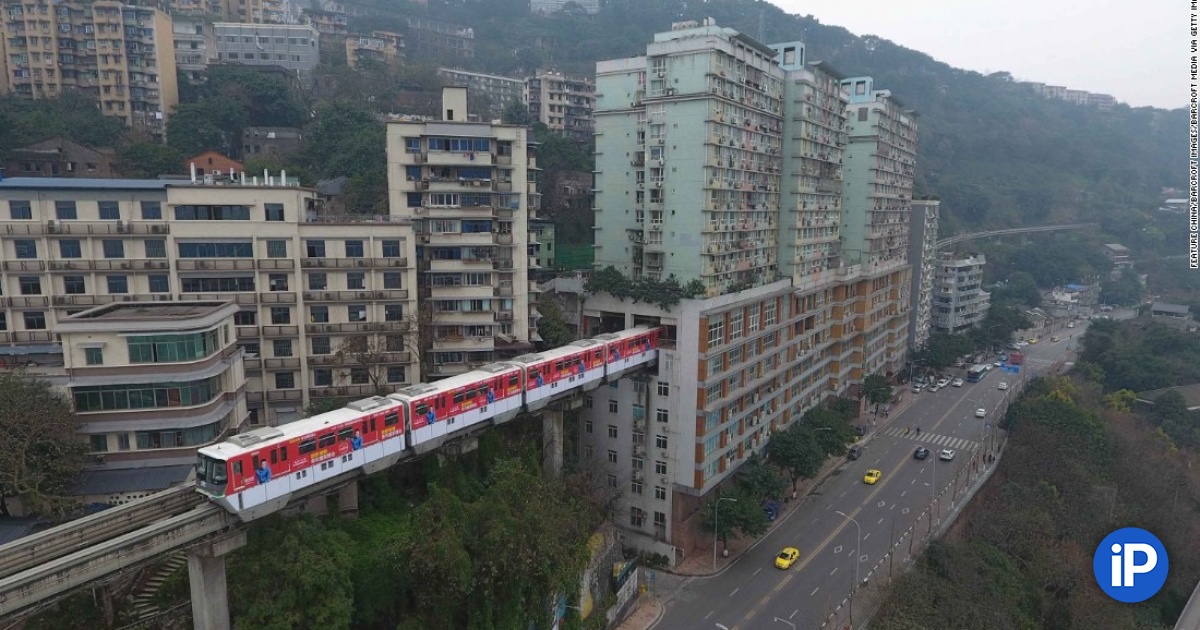 Comfortable!  Monorail in China passes right through a residential building, there is also a station for boarding