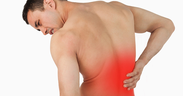 Back view of male suffering from back pain against a white background